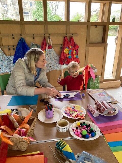 Mother and son take part in dragon making workshop