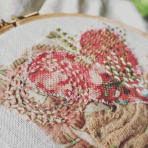 close up of hand embroidered heart