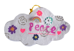 hand made cloud with embroidered decoration and word peace written on
